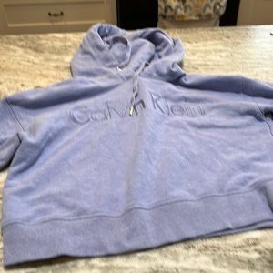 A woman’s Calvin Klein pullover sweatshirt